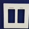a picture of an engraved Lutron stone finish plate two gang