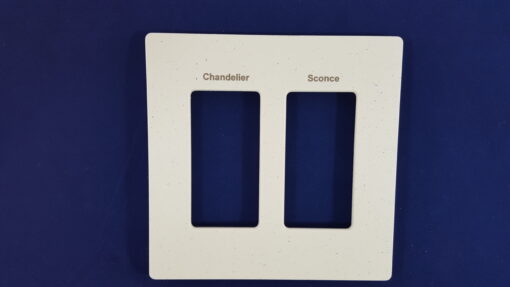 a picture of an engraved Lutron stone finish plate two gang