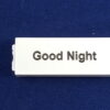 A Good Night Label in Black on White Button