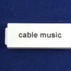 A Cable Music Label in Black on White Button
