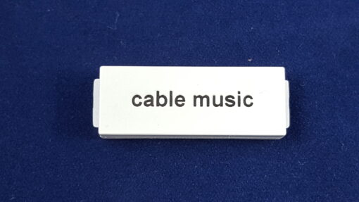 A Cable Music Label in Black on White Button
