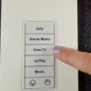A Picture of a TKP-100 Keypad with Pointing Finger