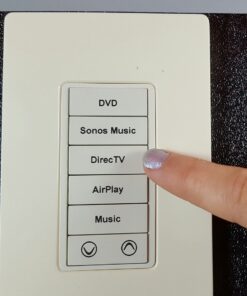 A Picture of a TKP-100 Keypad with Pointing Finger
