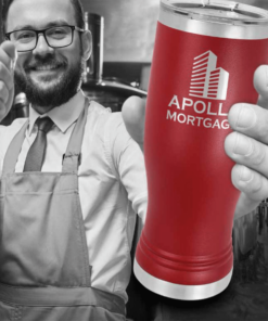 A Man in an Apron in Black and White Holding a Red Cup
